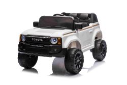 Electric ride-on car Toyota Landcruiser 12V, white, wide single seat, 2.4 GHz remote control, USB / AUX Input, Bluetooth, Suspension, Lithium battery, LED lights, 2 X 25W Engine, ORIGINAL license